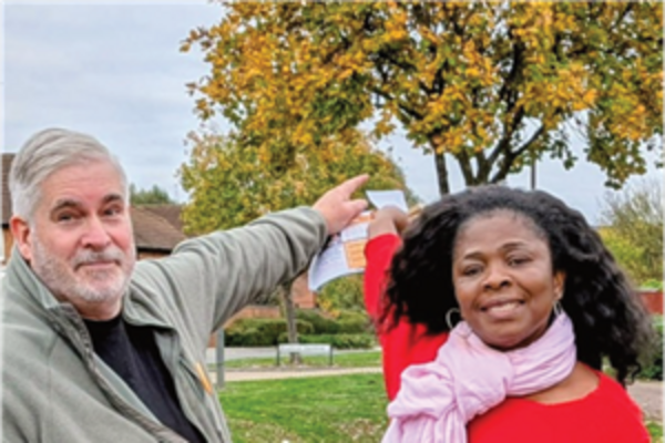 Candidates pointing at the trees behind them.
