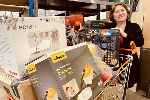 Jane Carr with a trolley of things available for loan