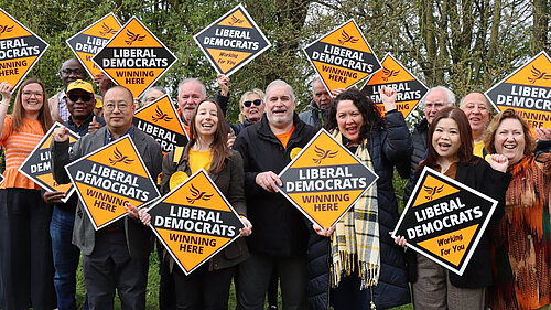 A group of Liberal Democrats holding Winning Here diamonds