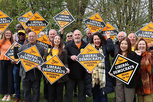 A group of Liberal Democrats holding Winning Here diamonds